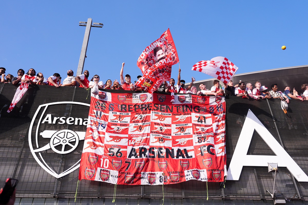 Arsenal fans celebrate outside the Emirates Stadium, London. The Gunners secured their first Premier League title for more than 20 years on Tuesday. Picture date: Sunday May 24, 2026.
