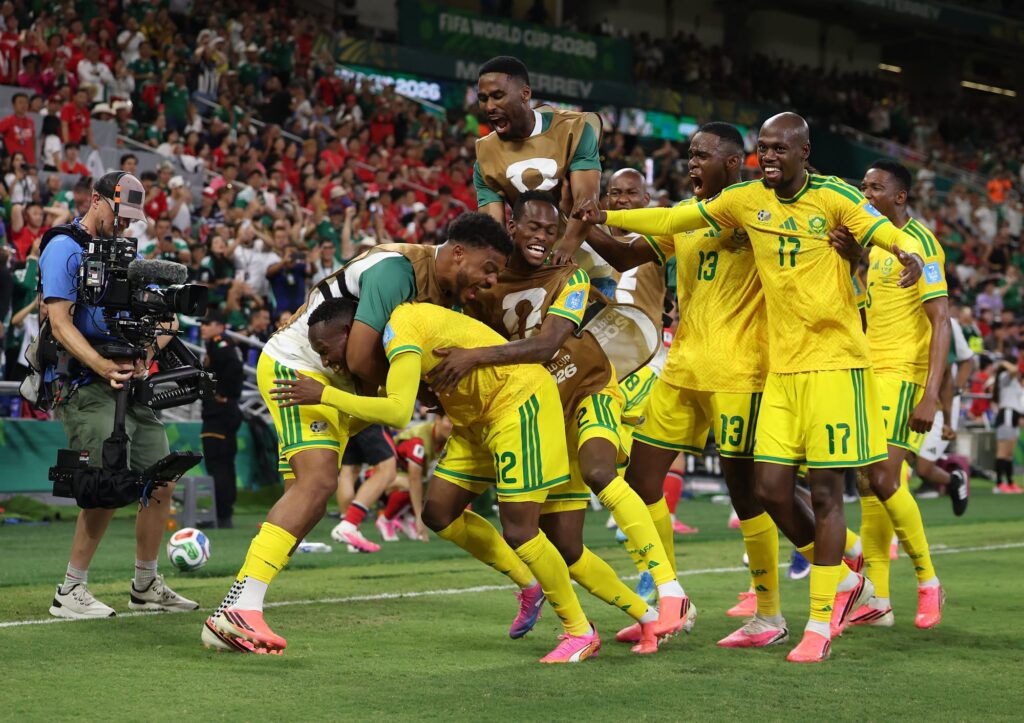 GUADALUPE, MEXICO - JUNE 24: Thapelo Maseko #12 of South Africa celebrates with teammates after scoring the team's first goal during the FIFA World Cup 2026 Group A match between South Africa and Korea Republic at Monterrey Stadium on June 24, 2026 in Guadalupe, Mexico. (Photo by Carl Recine/Getty Images)