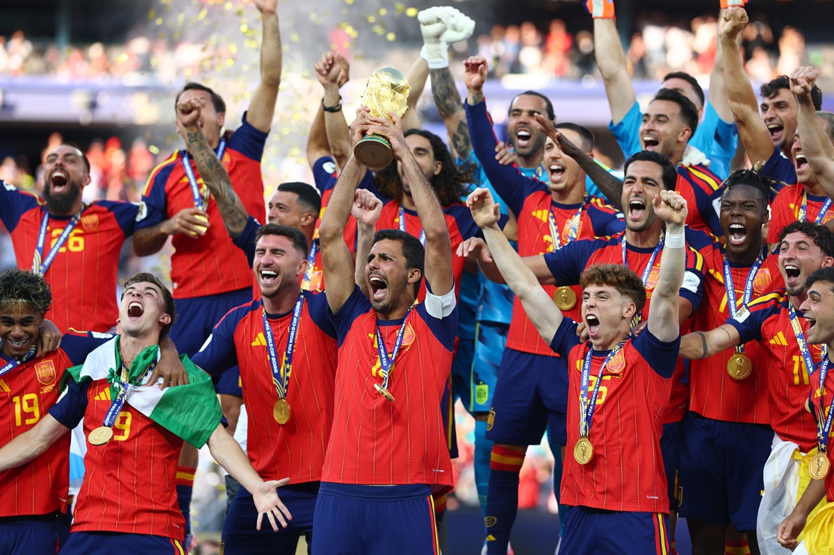 EAST RUTHERFORD, NEW JERSEY - JULY 19:   Rodri of Spain holds the trophy aloft with his team-mates following his team's victory at the end of the FIFA World Cup 2026 Final match between Spain and Argentina at New York New Jersey Stadium on July 19, 2026 in East Rutherford, United States. (Photo by Chris Brunskill/Fantasista/Getty Images)